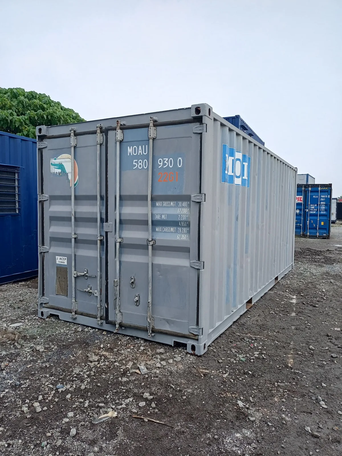 Actual used grey shipping container viewed at a container yard